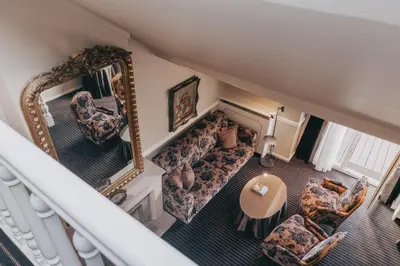 an overhead view of a living room with a couch and a mirror at Hotel Manos Premier in Brussels
