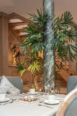 a table with plates of food on top at Hotel Manos Stephanie in Brussels