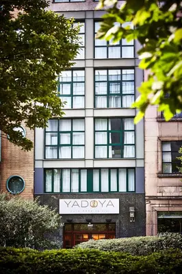 a building with a sign on the front of it at Yadoya Hotel in Brussels