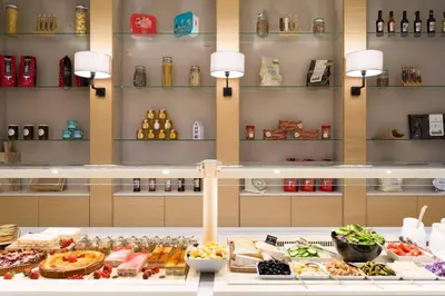 a buffet of food on display in a store at Courtyard By Marriott Brussels in Brussels