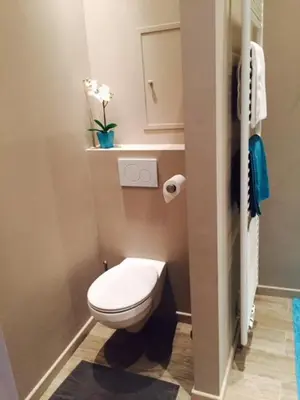 a small bathroom with a toilet and a sink at Suite 11 in Antwerp