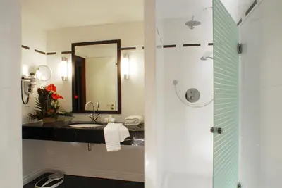 a bathroom with a sink and a mirror at Marivaux Hotel in Brussels
