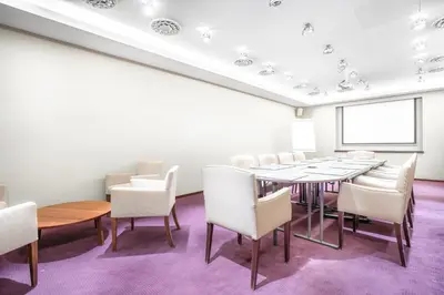 a conference room with a table and chairs at Marivaux Hotel in Brussels