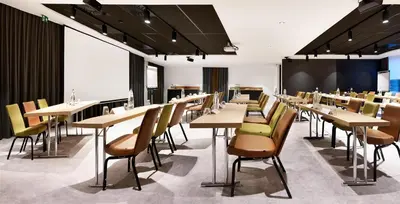 a dining room with tables and chairs at Park Inn By Radisson Brussels Airport in Diegem