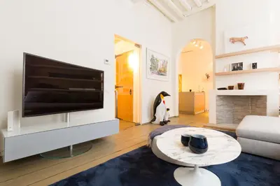 a living room with a large flat screen tv at Y & L villa in Antwerp