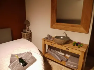 a bathroom with a sink on a wooden table at Relax Garden in Hulshout