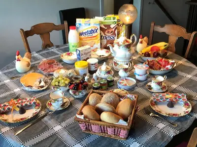 a table with food and eggs and chickens on it at B&B Bij MoeMee in Ghent