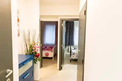 a hallway leading to a bedroom with a bed at Apartment in Antwerp city centre in Antwerp