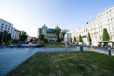 a group of people walking around a park in a city at Apartment in Antwerp city centre in Antwerp