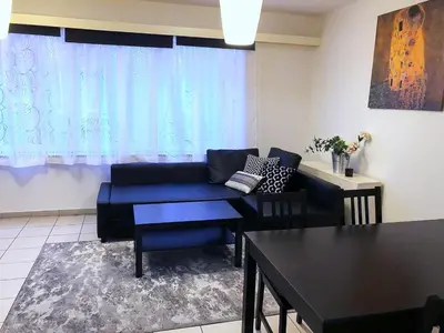 a living room with a couch and a table at Apartment in Antwerp city centre in Antwerp
