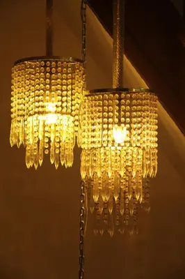 a large chandelier hanging from a ceiling at Hotel De Spiegel in Sint-Niklaas