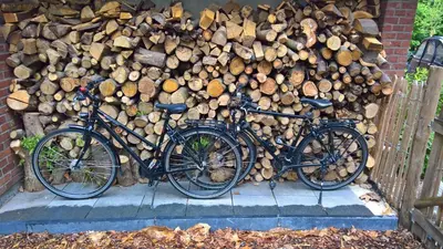 two bikes parked next to a pile of wood at Sweetwater Privé Wellness in Oud-Heverlee