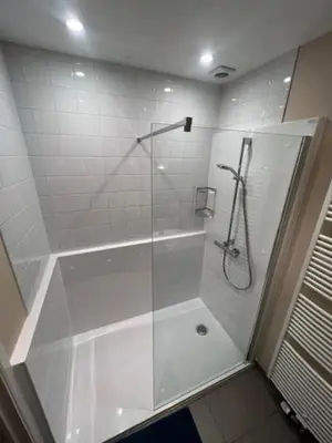 a shower with a glass door in a bathroom at Fantastic Large House in Brussels