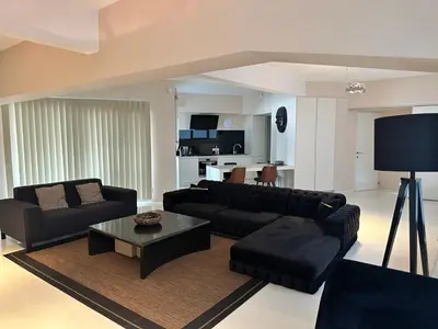 a living room with two black couches and a table at Beautiful LOFT in the Center of Brussels in Brussels