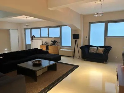 a living room with a couch and a table at Beautiful LOFT in the Center of Brussels in Brussels
