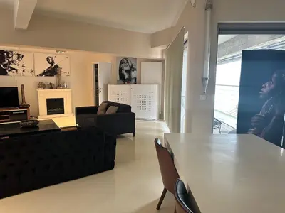 a living room with a table and a couch at Beautiful LOFT in the Center of Brussels in Brussels
