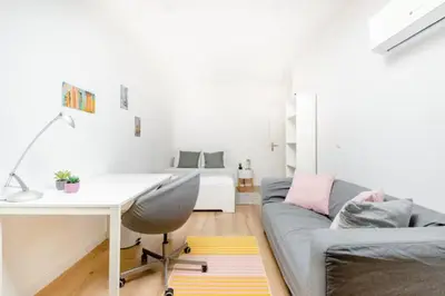 a living room with a desk and a couch at African heritage Tervuren in Tervuren
