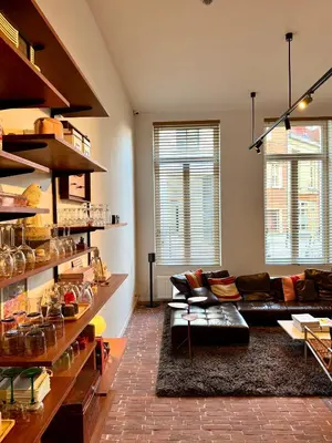 a living room with a couch and a table at Great to stay Gent I rooms & apartments in Ghent