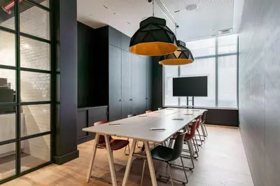 a conference room with a long table and chairs at Radisson RED Brussels in Brussels