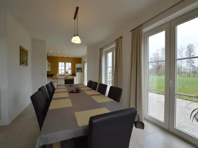 a conference room with a long table and chairs at Sint-Amands Country Escape in Sint-Amands