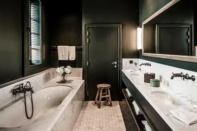 a bathroom with two sinks and a bath tub at 1898 The Post in Ghent