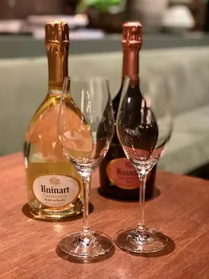 two bottles of wine and two glasses on a table at U Eat & Sleep Antwerp in Antwerp