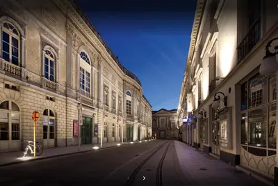 an empty city street at night with buildings at Lord of Ghent in Ghent