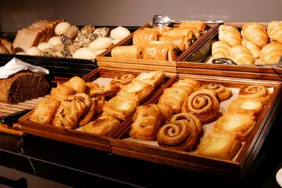 a bakery filled with lots of different types of pastries at Pillows City Hotel Brussels Centre in Brussels
