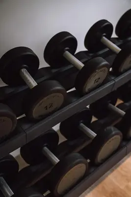 a bunch of dumbbells on a shelf at Pillows City Hotel Brussels Centre in Brussels