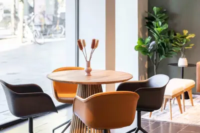 a table and chairs in a room at Park Inn by Radisson Antwerp City Centre in Antwerp
