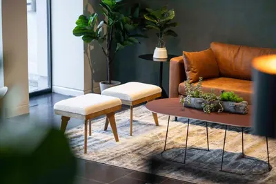 a living room with a couch and a table at Park Inn by Radisson Antwerp City Centre in Antwerp