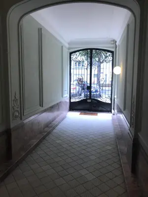 a hallway with an open door to a building at Appartement Chic in Brussels