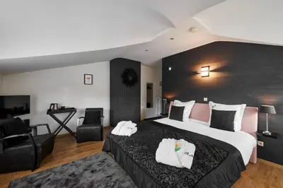 a hotel room with a large bed with towels on it at B&B Bertem Natuur in Leuven