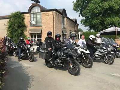a group of people on motorcycles parked in front of a building at B&B Bertem Natuur in Leuven