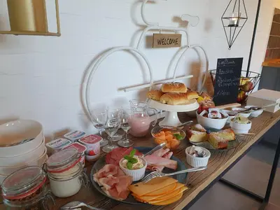 a table with a buffet of food on it at B&B 't Hoogste in Bornem