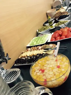 a table topped with lots of different types of food at Hotel Prestige in Brussels