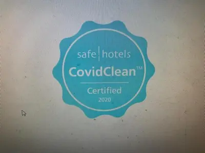 a sign that reads safe hotels covenant cleaners certified at Hotel Prestige in Brussels