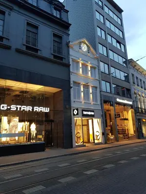 a group of buildings on a city street at Huidreal Meir in Antwerp