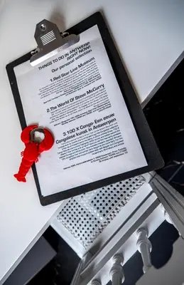 a certificate with a red ribbon on top of a table at Rock Lobster City Lodge in Antwerp