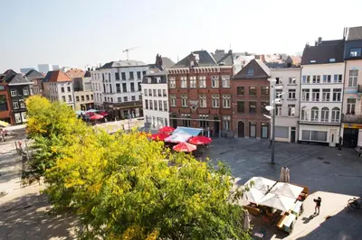 a view of a city with buildings and umbrellas at Antwerp For Two B&B in Antwerp