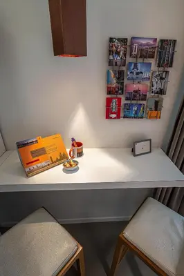 a table with a book and two chairs on it at Antwerp For Two B&B in Antwerp