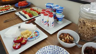 a table topped with plates of food and drinks at B&B La Clé du Sud in Merelbeke