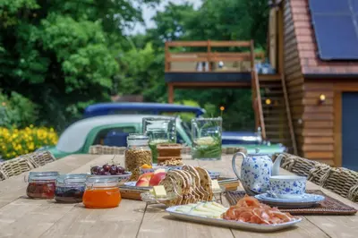a picnic table with food on top of it at Villa Magdalena Eeklo in Eeklo