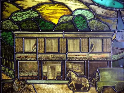 a stained glass window of a train at Hotel Mieke Pap in Poppel