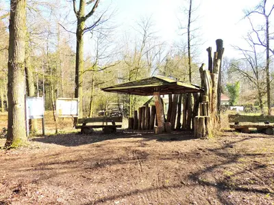 a picnic shelter in the middle of a forest at Hotel Mieke Pap in Poppel