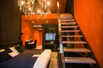 a room with a bunk bed and a staircase at Hotel Moon in Sint-Niklaas
