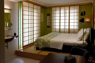 a room with a bed in a room with japanese window at Guesthouse PPP in Ghent