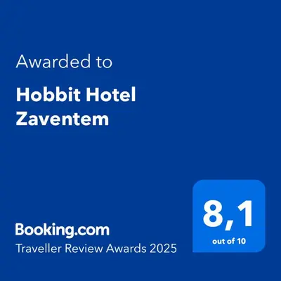 a blue sign with the text awarded to hobbit hotel zenwegian at Hobbit Hotel Brussels Airport Zaventem in Zaventem