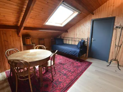 a room with a table and chairs and a window at Lovely Holiday Home in Merksplas with Fenced Garden in Merksplas
