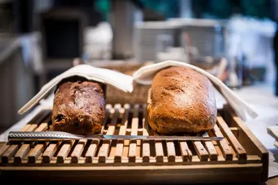 two loaves of bread sitting on a grill at Hotel In den Bonten Os in Rijmenam